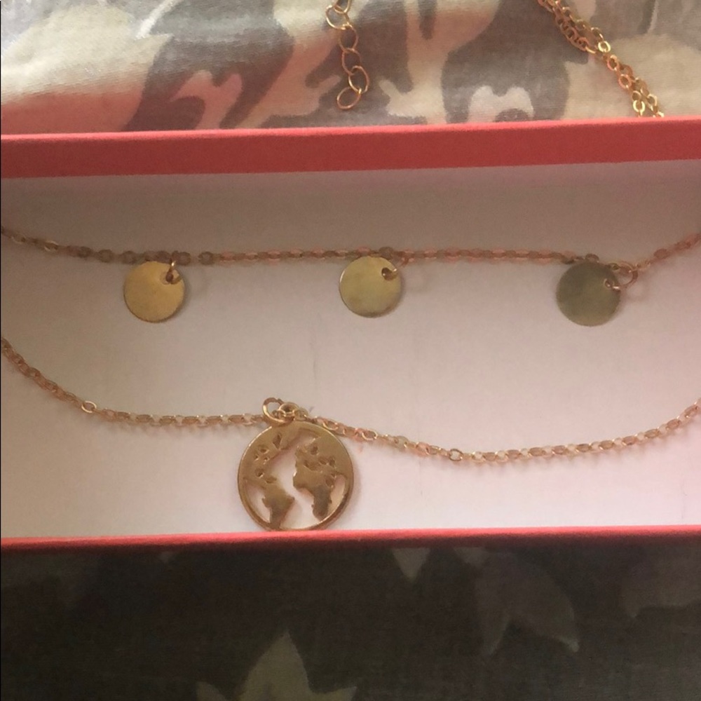 Double chain necklace with world map pendant